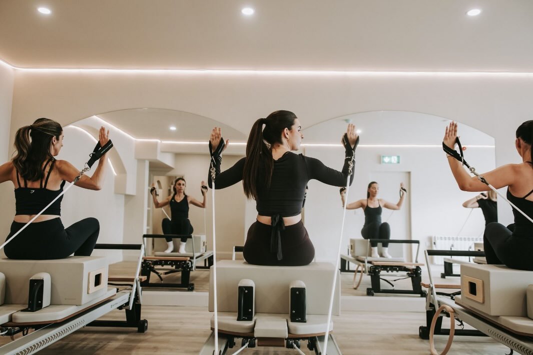 Pilates reformer class in session at Anú Pilates Studio